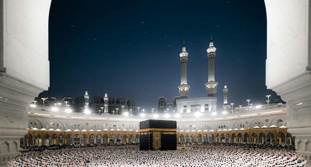 A breathtaking night view of pilgrims at the Kaaba in Masjid al-Haram, Makkah, Saudi Arabia.
